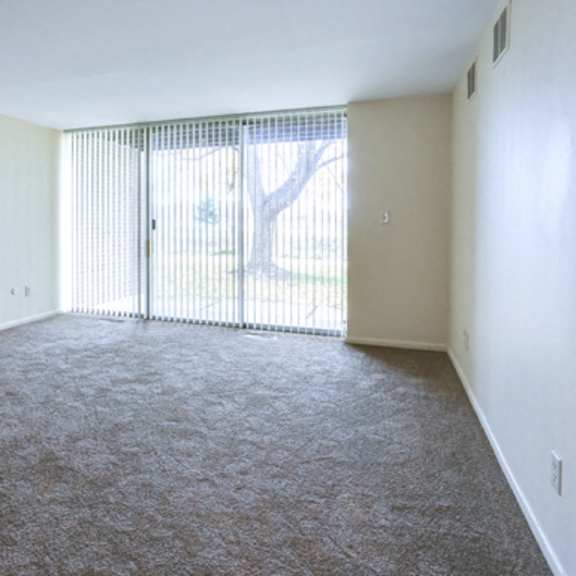 amherst manor apartments - living room – sliding door – outdoor space - ask for a tour - pet friendly