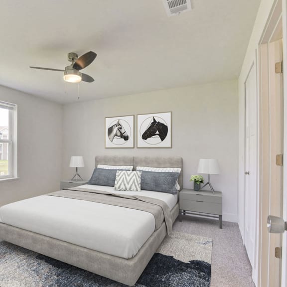 Thumbnail 15 of 17 Master bedroom with large window and ceiling fan at Eagle Ridge Apartment Homes,  Michigan 49685