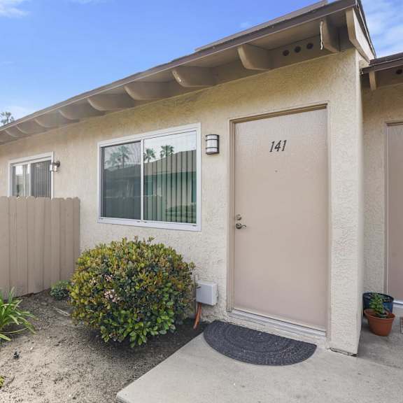 a house with the number 141 on the door.