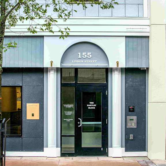 the front of a building with the number 155 on it.