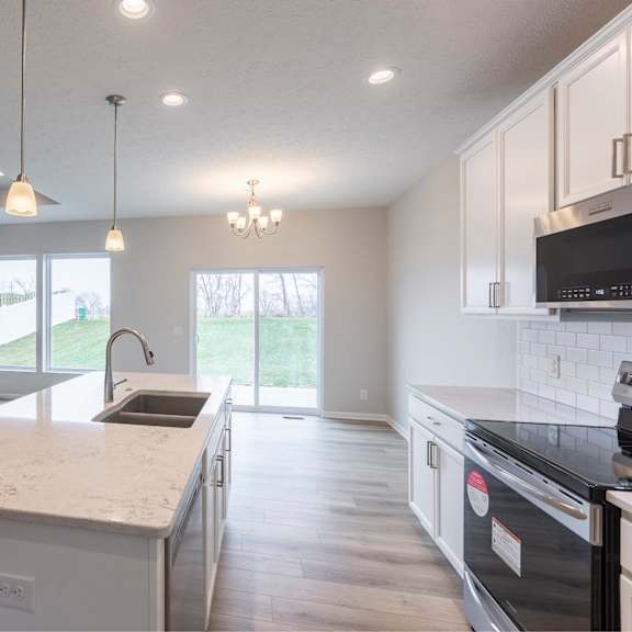 a modern kitchen with a large island in the middle.