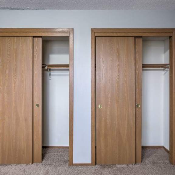 two wooden doors in a room.