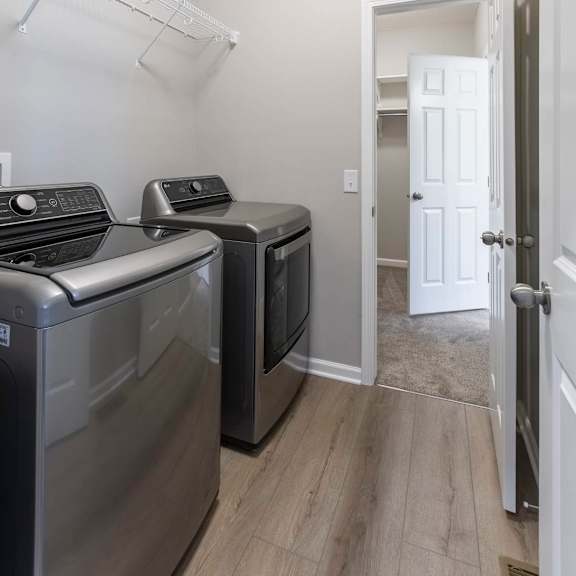 a laundry room with a washer and dryer.