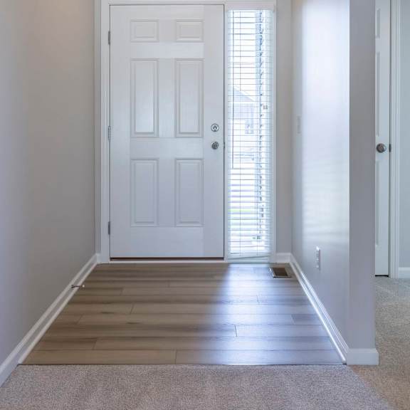 a white door with a window above it.