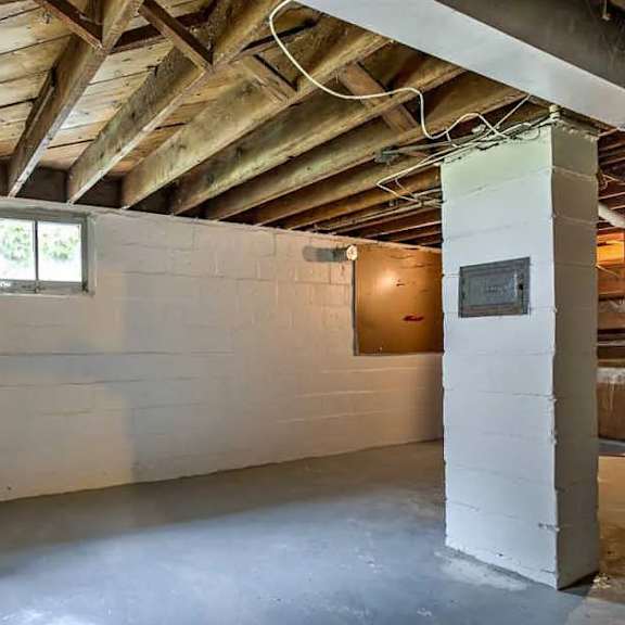 a room with a window and a door on the right side.
