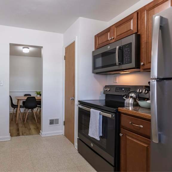 a kitchen with a black oven and a black microwave.