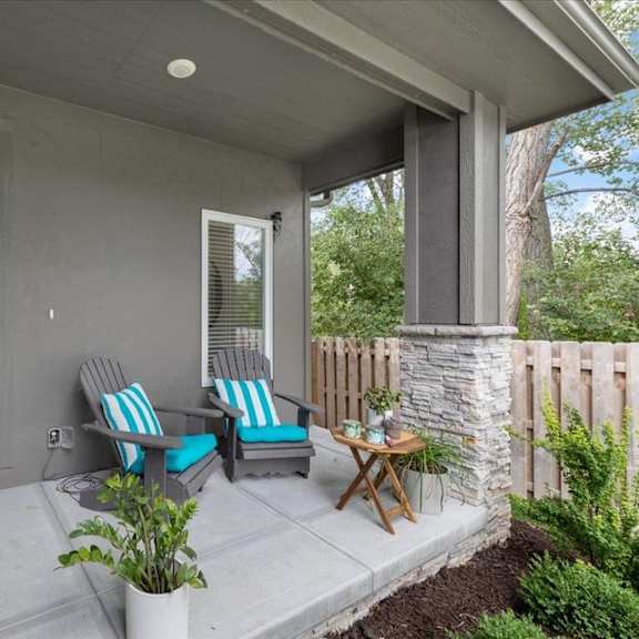 a house with a blue door and a small porch.