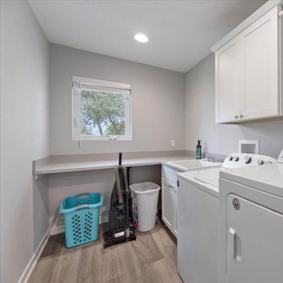 a white washing machine and dryer in a laundry room.