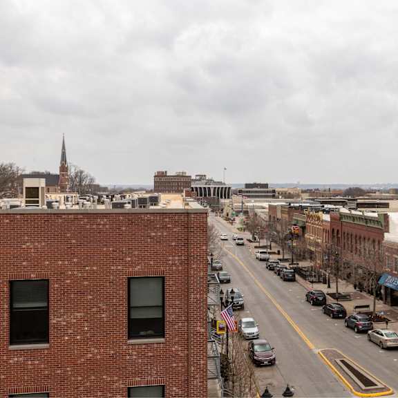 a city street with cars and buildings.