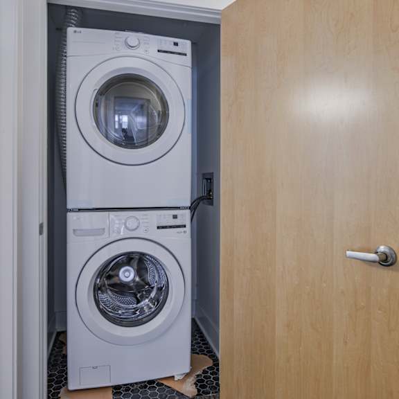 a washing machine is in a doorway.