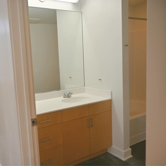 a bathroom with a sink and a mirror.