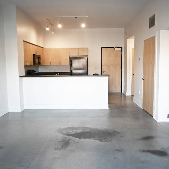 a kitchen area with a counter and cabinets.