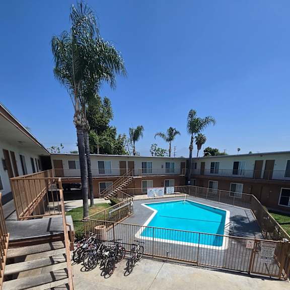a pool surrounded by buildings.