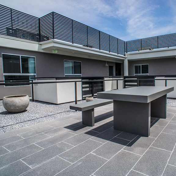 courtyard rooftop with tables and benches for entertaining