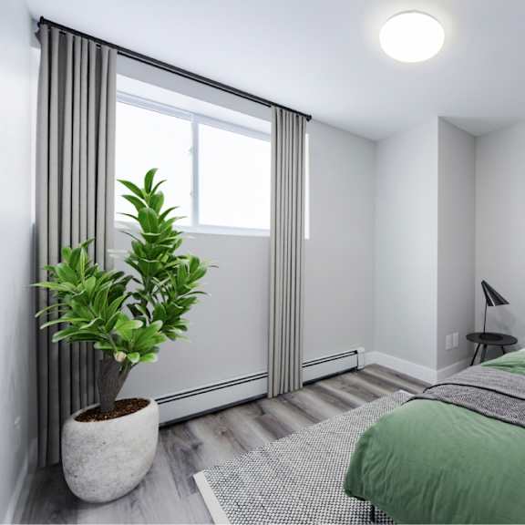 renovated bedroom with vinyl plank flooring.