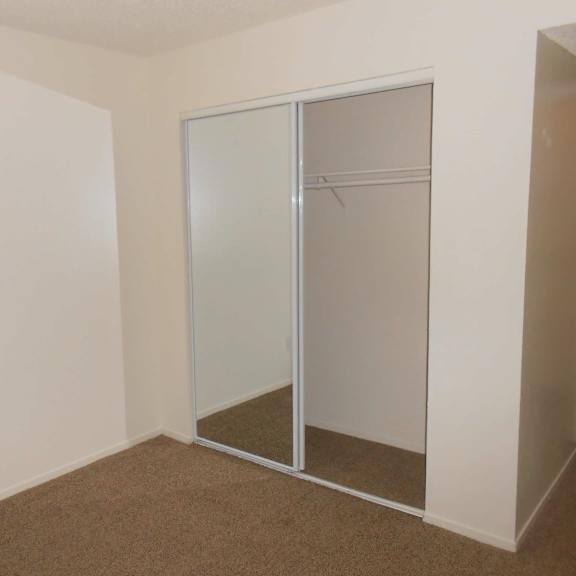 a room with a white wall and a glass door.