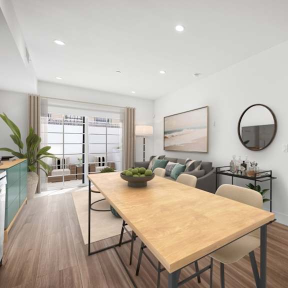 a modern dining room with a wooden table and chairs.