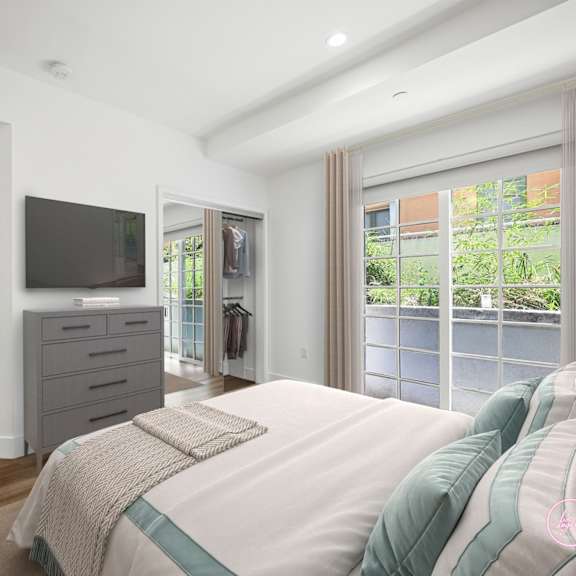 a bedroom with a large bed and a painting on the wall.