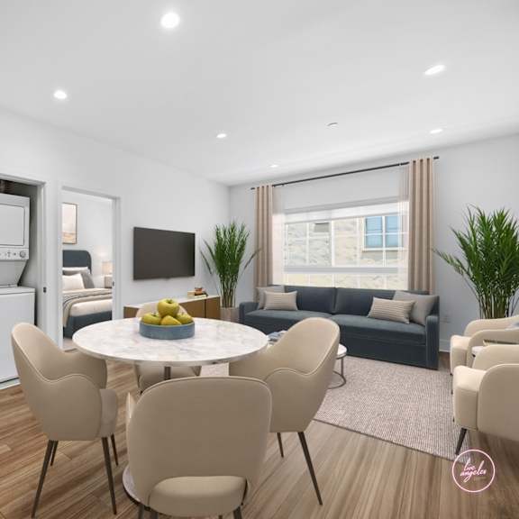 a modern living room with a dining table and chairs.