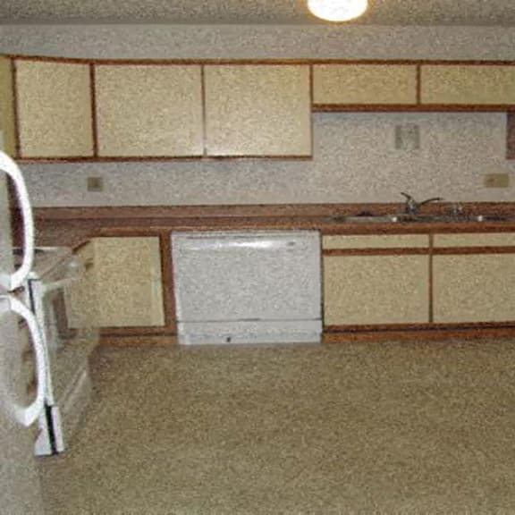 kitchen with white cabinets and large counter space