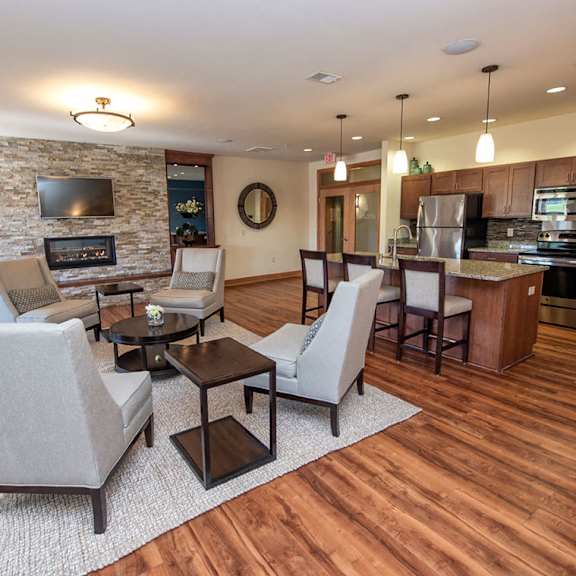 a living room with a kitchen and a dining room