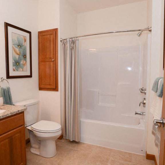 spacious bathrooms with garden tubs at highlands at riverwalk apartments 55+, 10954 n cedarburg road, mequon