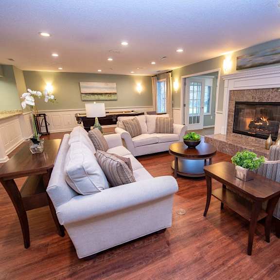 a living room with a fireplace and a couch.
