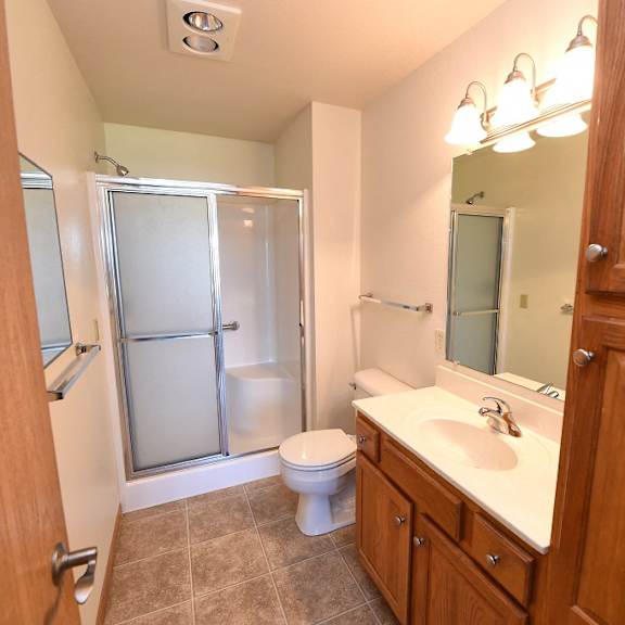 bathroom with large linen closet