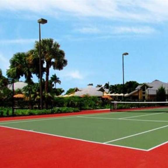 tennis court at the villages of bayan grove apartments in boynton beach