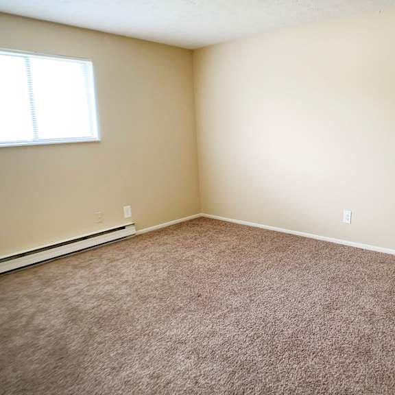 carpeted bedroom at crown station apartments, amelia, oh, 45102