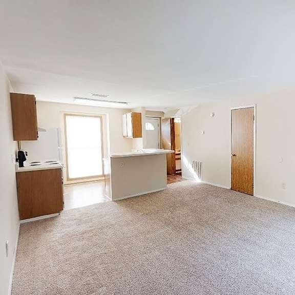 carpeted living area at woodhills apartments, west carrollton, oh