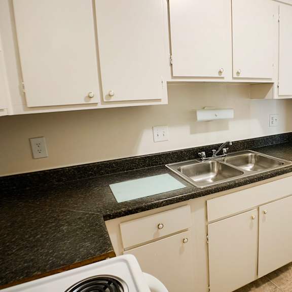 kitchen with cabinets at oakwood apartments, florence, kentucky