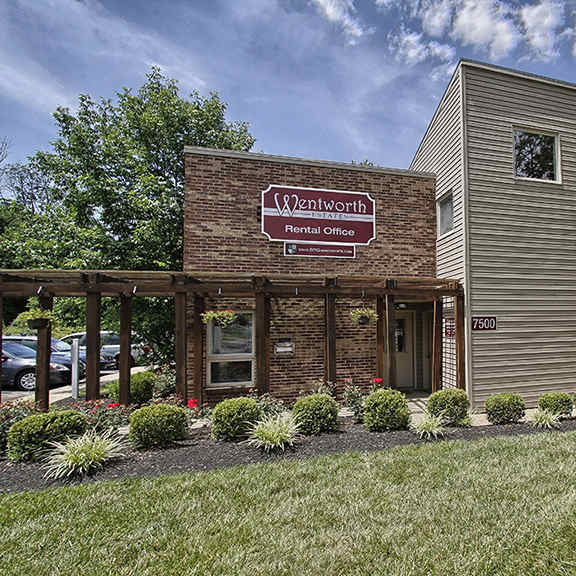 a brick building with a sign on the side of it at wentworth estates apartments, florence, ky, 41042