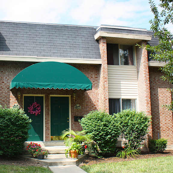 the front of a house with a green awning at wentworth estates apartments, kentucky