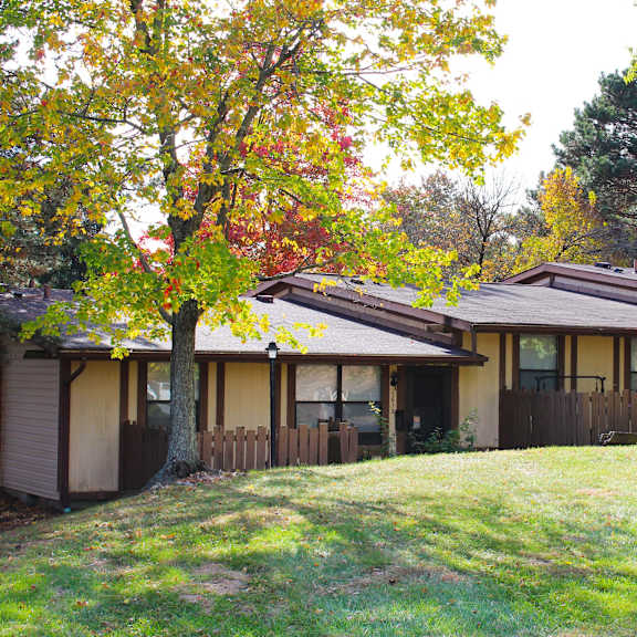 a house with a yard and trees in front of it  at wentworth estates apartments, kentucky