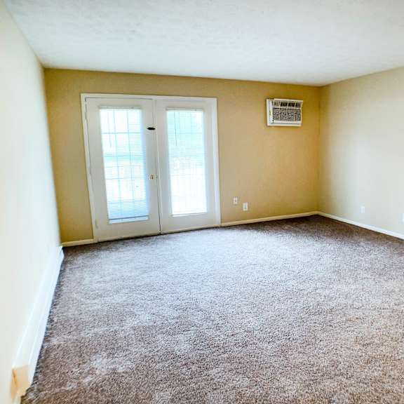 carpeted living room  at concord woods apartments, ohio, 45150