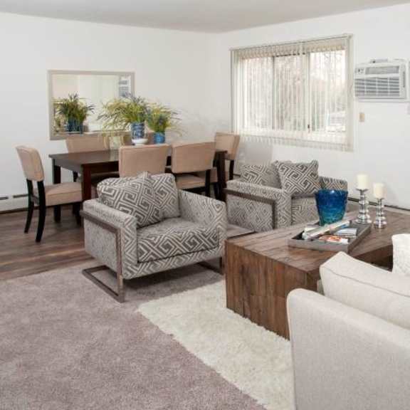 large natural light windows in open living and dining room floor plan at 8920 wentworth apartments