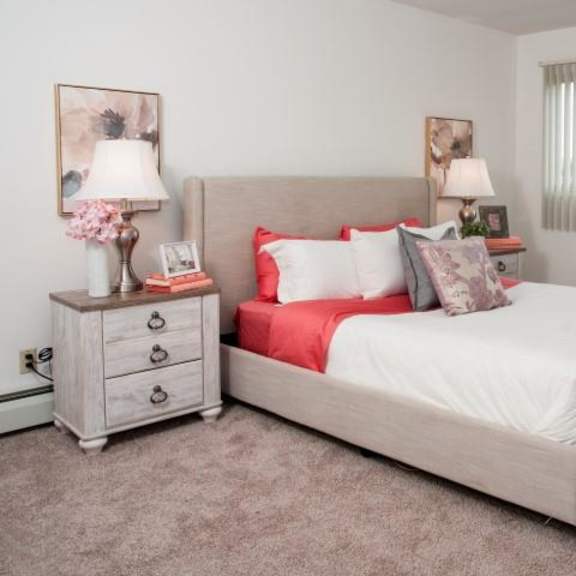 large master bedroom with wide full wall windows in bloomington apartment