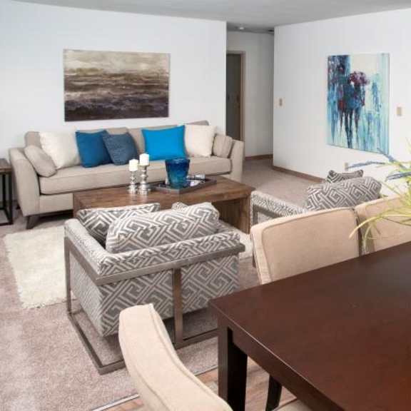 open living room and dining room with hardwood floors in bloomington apartment