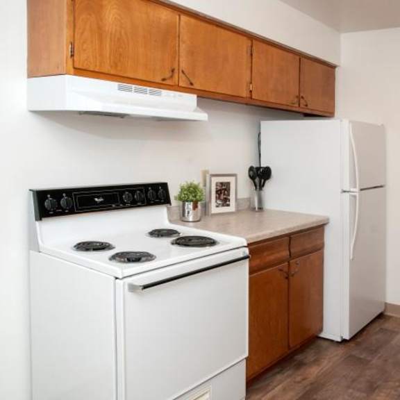 kitchen in bloomington apartment with gas stove and light counter tops