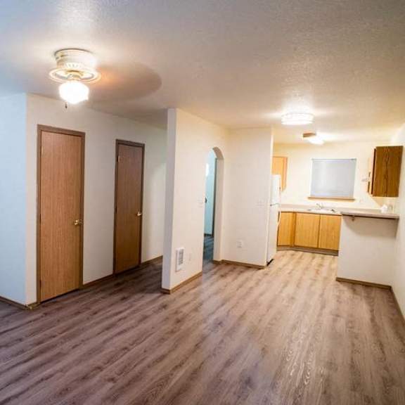 wood floor living room at lorence court apartments, portland, or, 97216