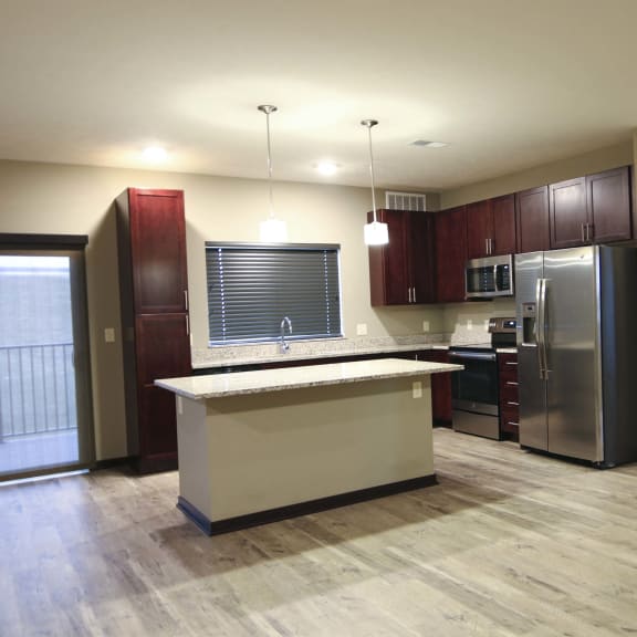 Thumbnail 3 of 19 Spacious kitchen with granite countertops in a 3 bedroom apartment for rent at North Pointe Villas best new apartments Lincoln NE 68521