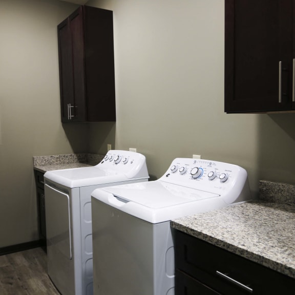 Thumbnail 5 of 19 Private laundry room with washer and dryer included in the Harrison floor plan at North Pointe Villas best apartments Lincoln NE 68521