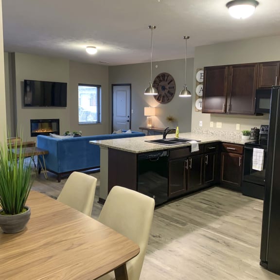 Thumbnail 2 of 19 Kitchen and dining area in a Harper three bedroom floor plan apartment at North Point Villas in Lincoln Ne