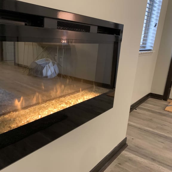 Thumbnail 6 of 19 The Harper three bedroom floor plan features a modern electric fireplace