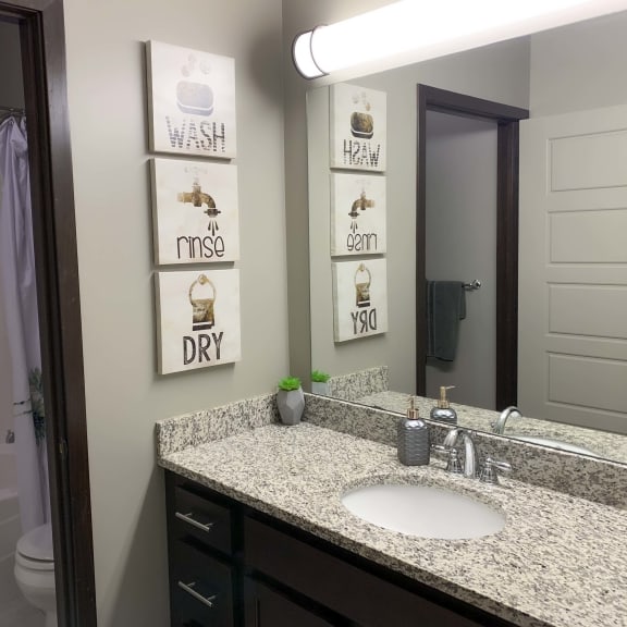 Thumbnail 11 of 19 Bathroom with granite countertop at North Pointe Villas