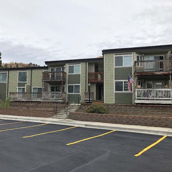 view of apartment building from parking lot