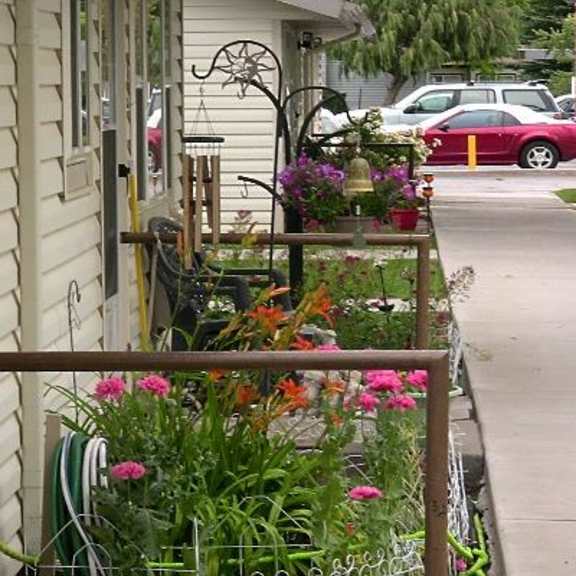 view of sidewalk to parking area