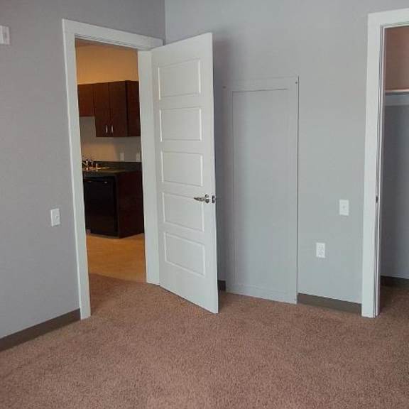bedroom view of bathroom door