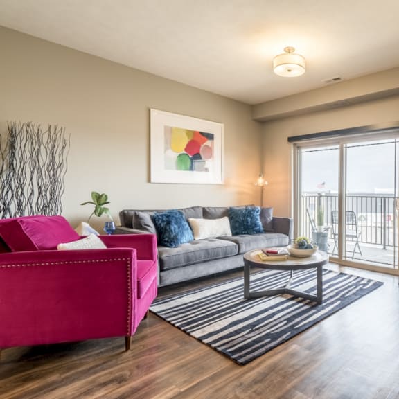 Thumbnail 9 of 13 Living room with natural lighting at 360 at Jordan West